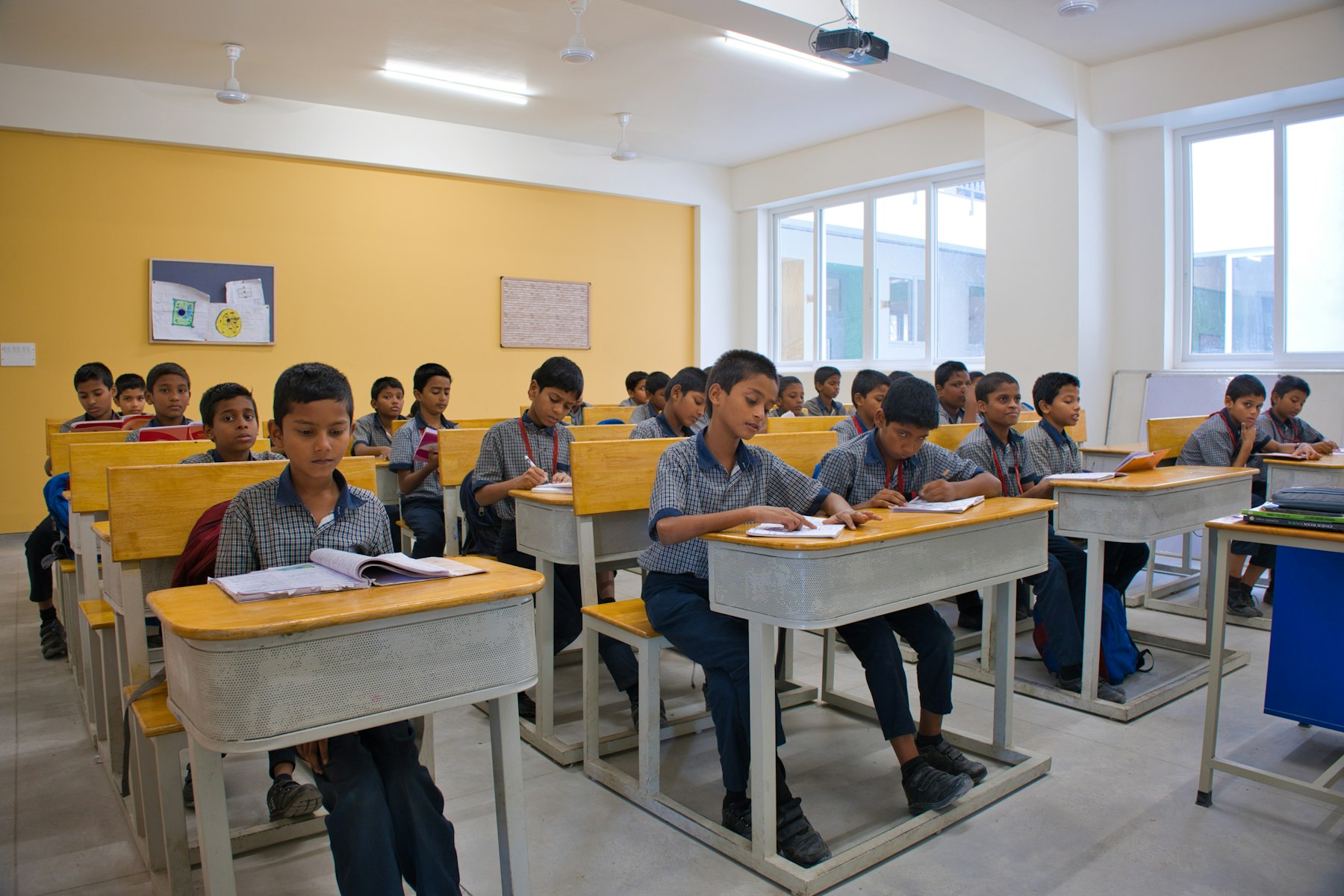 School boys seated at desks during a lesson in a Chennai smart classroom
